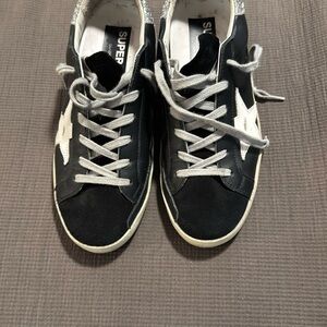 Golden Goose Super-Star Black & White Women’s Sneakers with Silver Glitter Heel